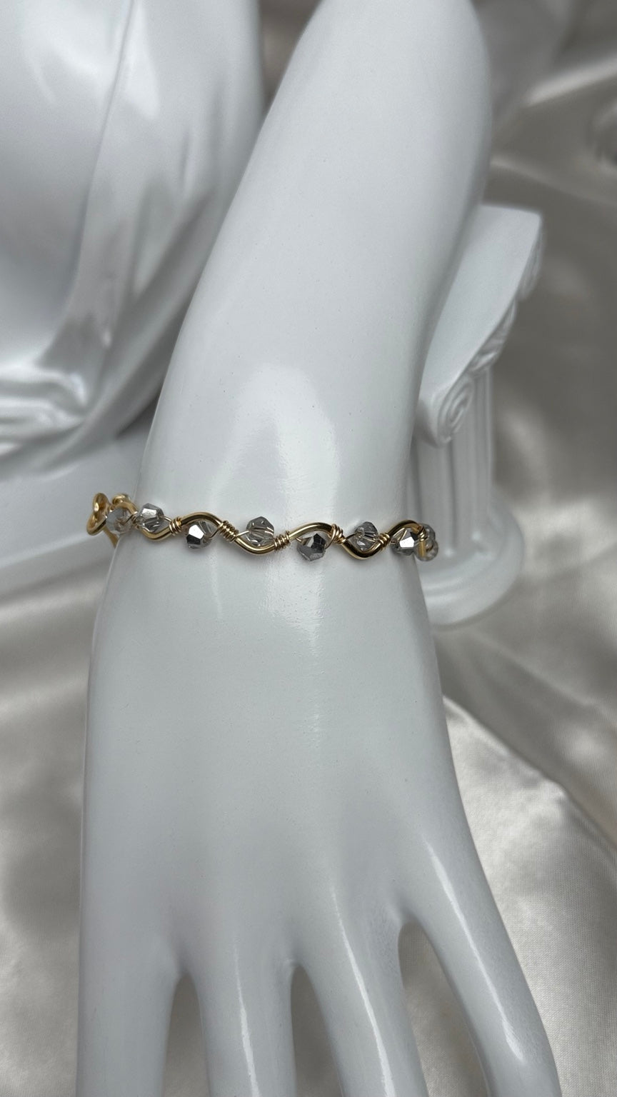 Handmade gold wire-wrapped crystal bracelet with clear and gray beads