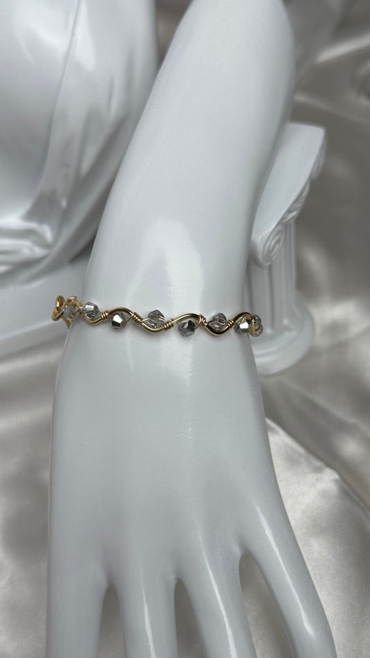 Handmade gold wire-wrapped crystal bracelet with clear and gray beads