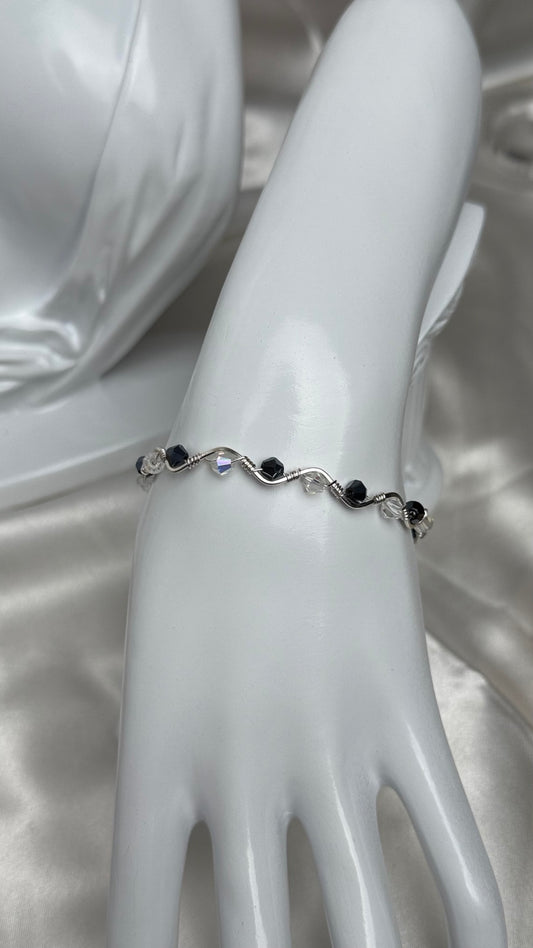 Handmade silver wire-wrapped crystal bracelet with black and clear beads
